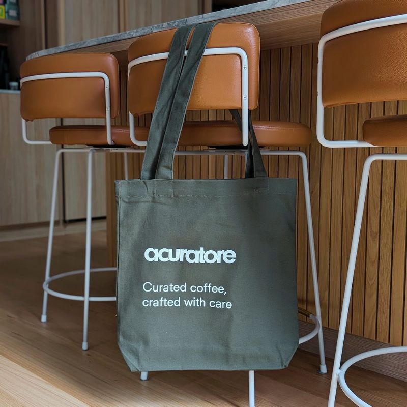 Acuratore Tote bag hanging on stool